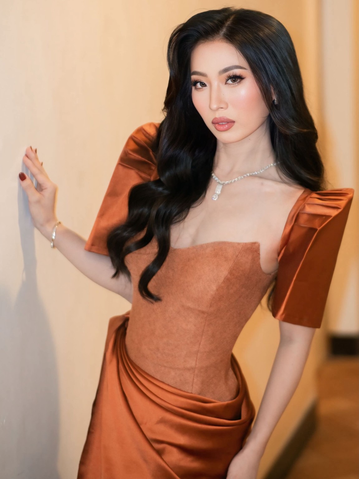 Scarlet Chua in copper dress